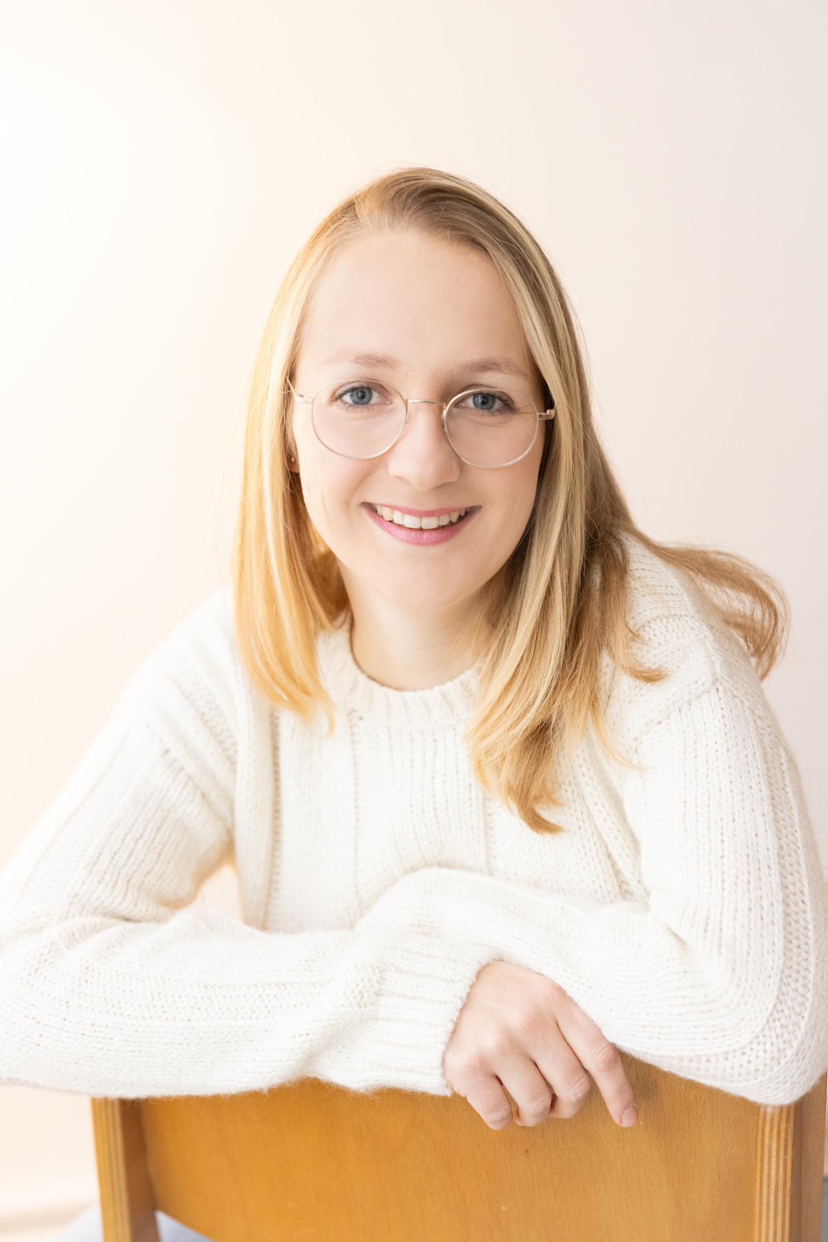 Professional portrait of Dr. Vera Vogel in medical consultation setting, representing her journey from traditional medicine to psychosomatic medicine